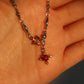 Platinum Plated Garnet Diamond Cross Necklace