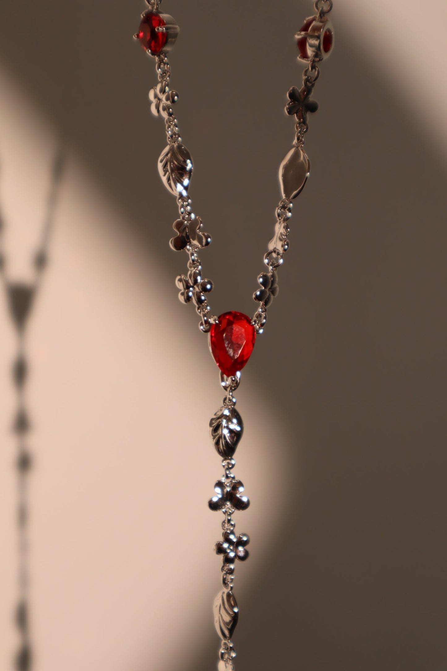 Platinum Plated Red Gem Cross Lariat Necklace