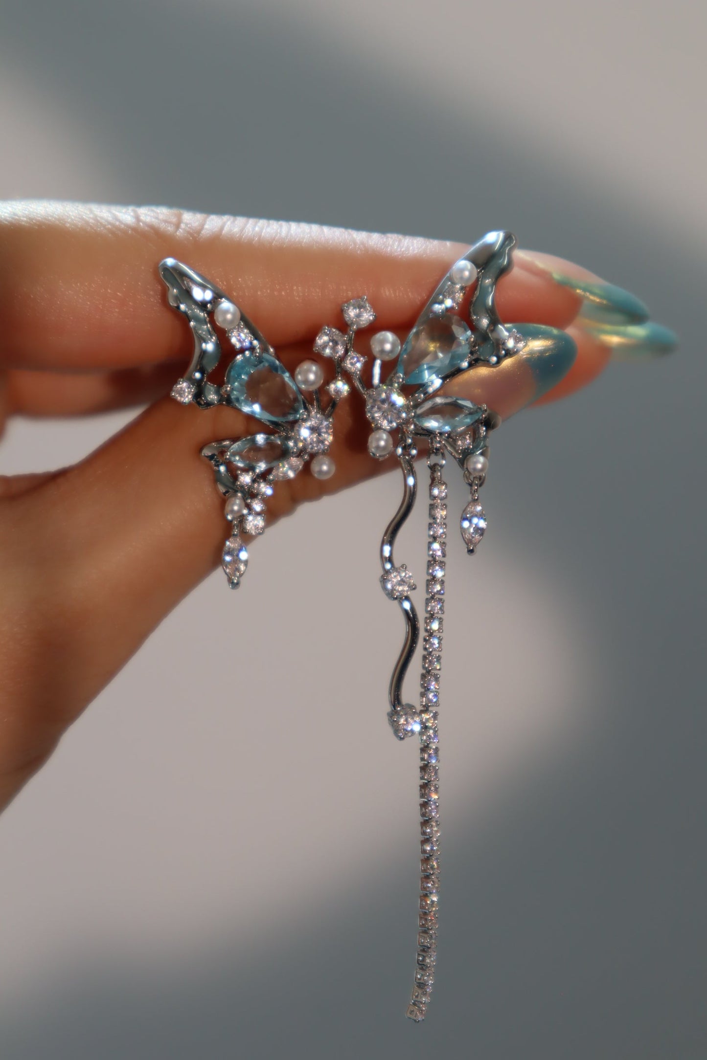 Platinum Plated Blue Gem Butterfly Earrings