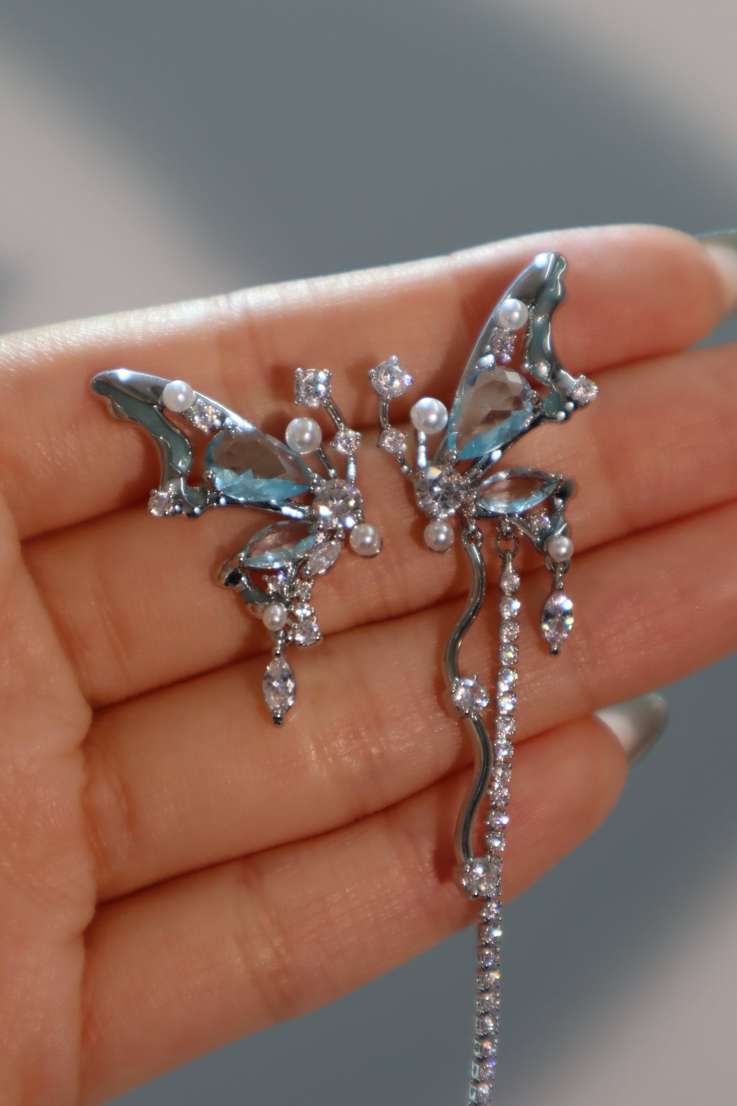 Platinum Plated Blue Gem Butterfly Earrings