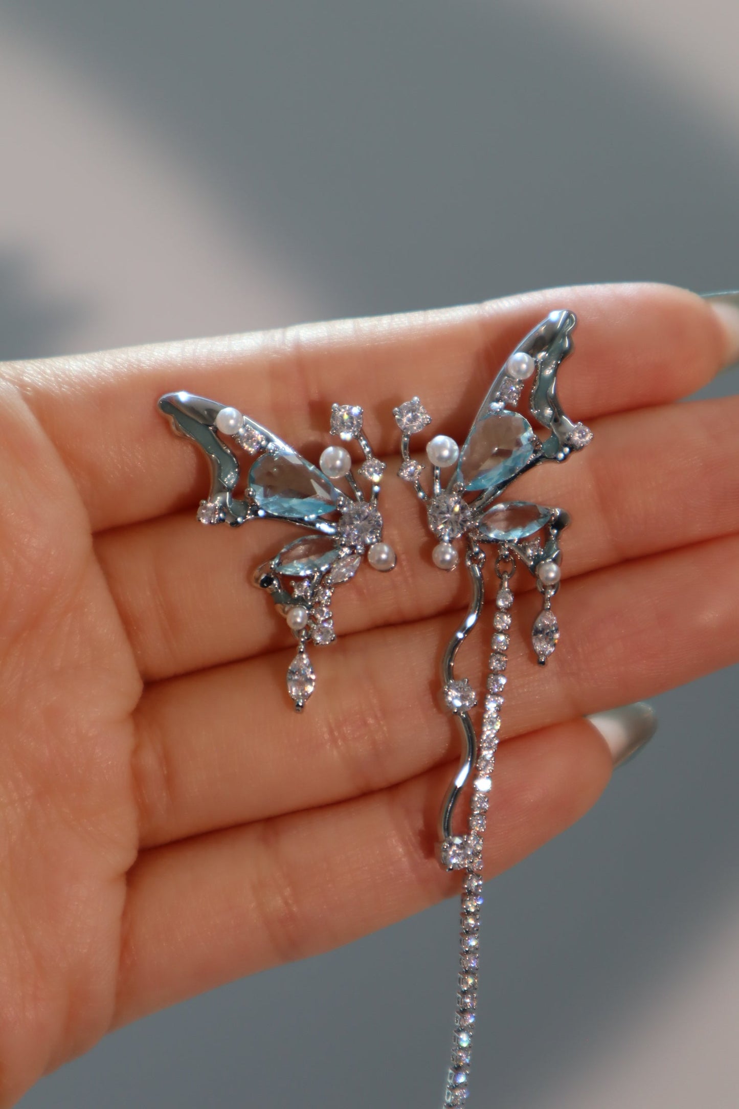 Platinum Plated Blue Gem Butterfly Earrings